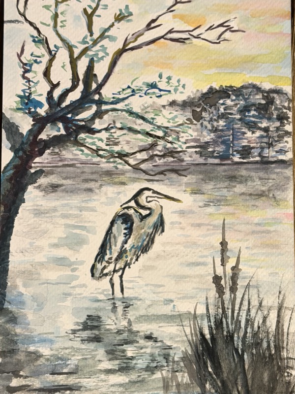 Watercolour of a heron in the reeds beneath a bare tree, a yellow dawn sky behind.