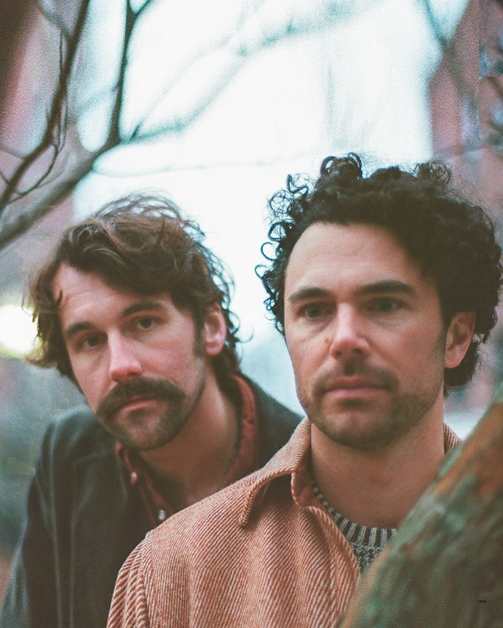 Tim Harrington and Paul Wright on a Boston street in winter.