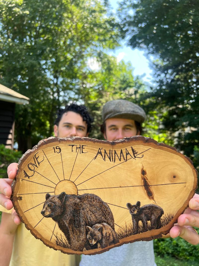 The two of us peeking over the wood burning