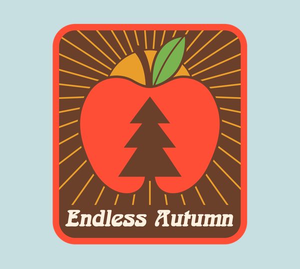 The Endless Autumn iron-on patch: a pine tree inside an apple